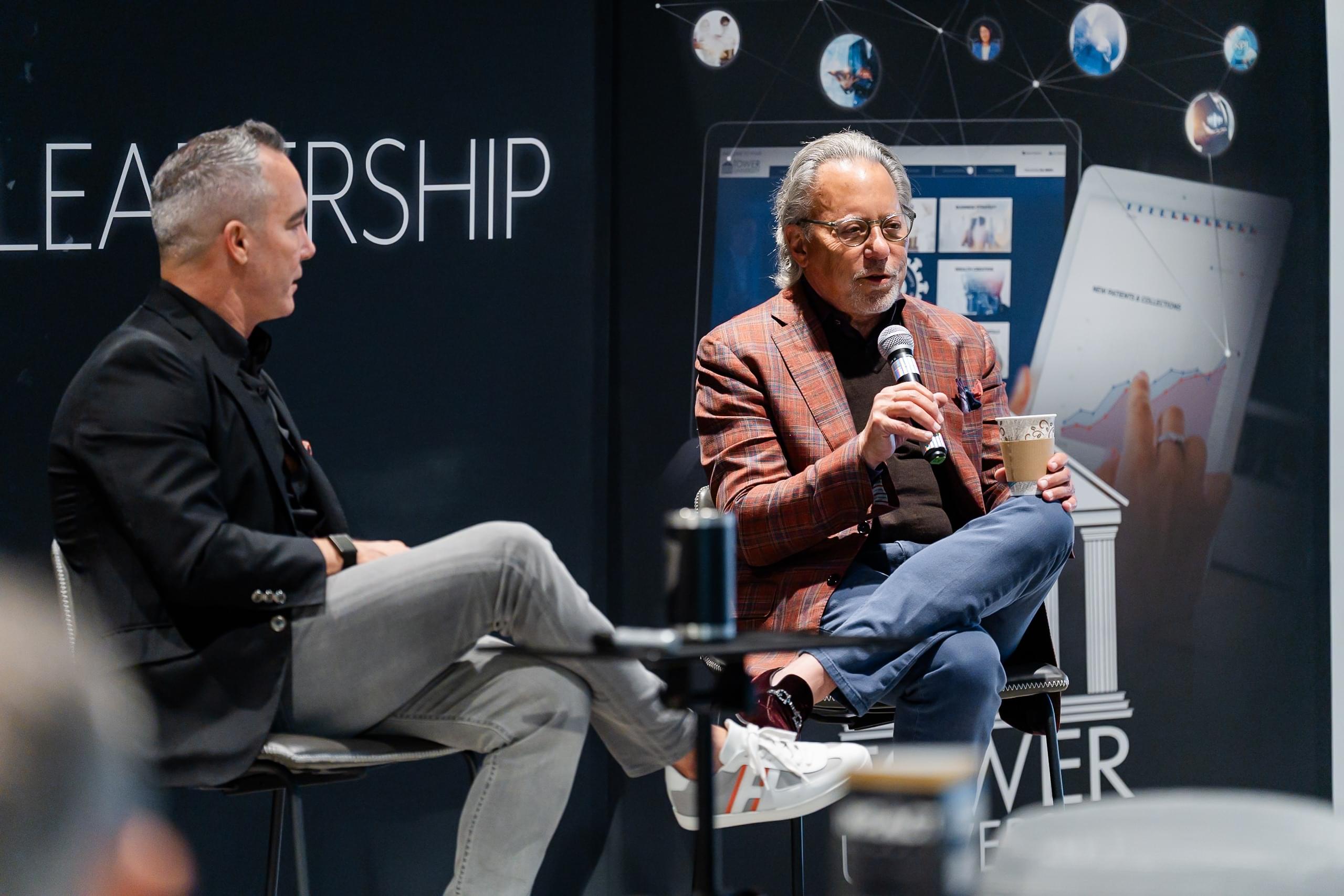 Eric J Morin and Jay Abraham speaking to a group of doctors at the Tower event space